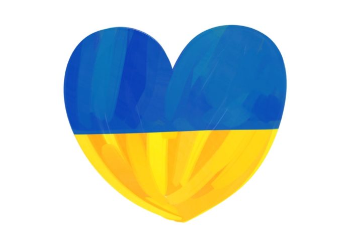 Jednorazowe świadczenie pieniężne. Na białym tle umowny kształt serca w barwach ukraińskiej flagi. Niebiesko żółte.