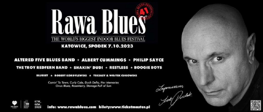 41 Rawa Blues Festival - Czarny baner a na nim białymi literami nazwa imprezy, jej data i miejsce. Nazwiska gwiazd oraz czarno-biała twarz Irka Dudka.