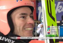 Stefan Kraft - zbliżenie na twarz uśmiechniętego skoczka narciarskiego po zwycięstwie odniesionym w Zakopanem. Na głowie różowo-kremowy kask.