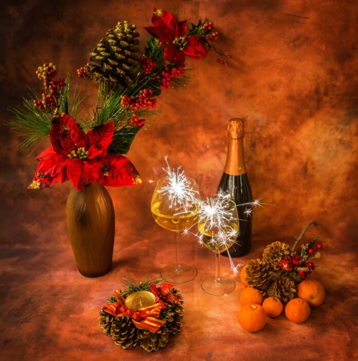 noworoczne postanowienia a na widoku szampan i pomarańcze