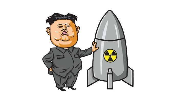Hakerzy kim Dzong Una - karykatura północno-koreańskiego dyktatora opartego o rakietę atomową.