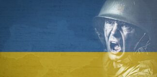 Kijów ściąga Ukraińców na wojnę, żołnierz na tle flagi Ukrainy